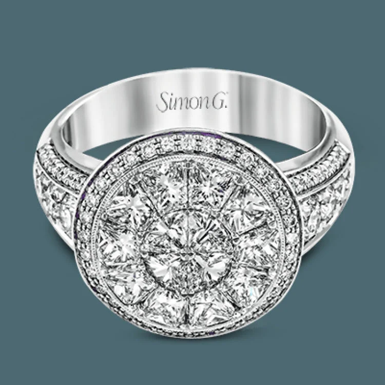 ladies rings with crystal sparkle -This spectacular ring features a Simon Set center feature with 1.85 ctw of custom-cut diamonds that fit perfectly together. The rest of the ring contains .72 ctw of round diamonds.