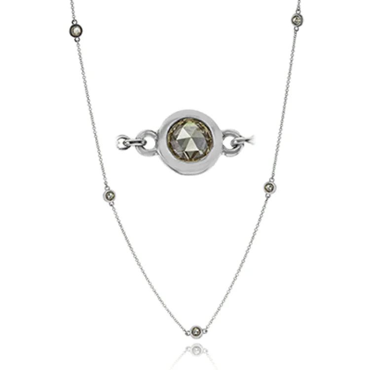 ladies rings with green emerald -A fun layering piece, this 18K white gold necklace from the diamonds by the yard collection, has stations of rose cut brown dimonds in a bezel setting 1.40 ctw