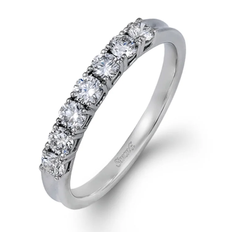 ladies rings with opal shimmer -Elegantly simple, this classically styled white gold band is accented by the presence of .50 ctw of shimmering round cut white diamonds.