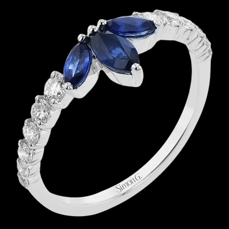 ladies rings promise ring design -This 18k white gold ring creates the look of two rings in one, with a center design of .66 ctw of sapphires accented by .61 ctw of white diamonds.