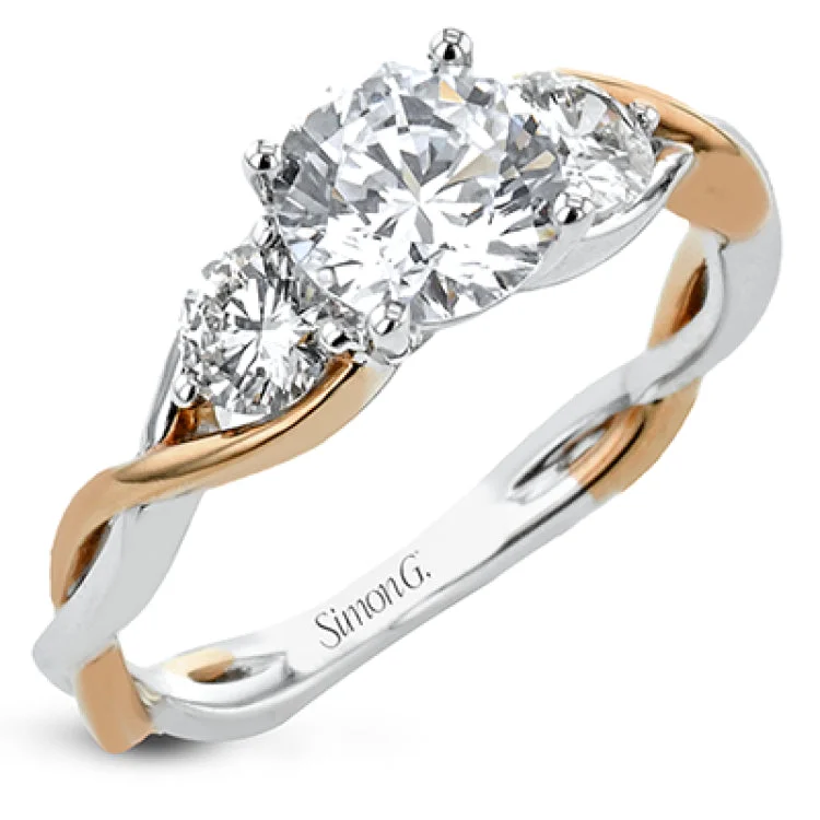 ladies rings eternity band style -This 18K three stone ring in two-tone gold has a delicate twist design with a polished yellow gold side and a polished white gold side. The center is highlighted by two RD diamonds.