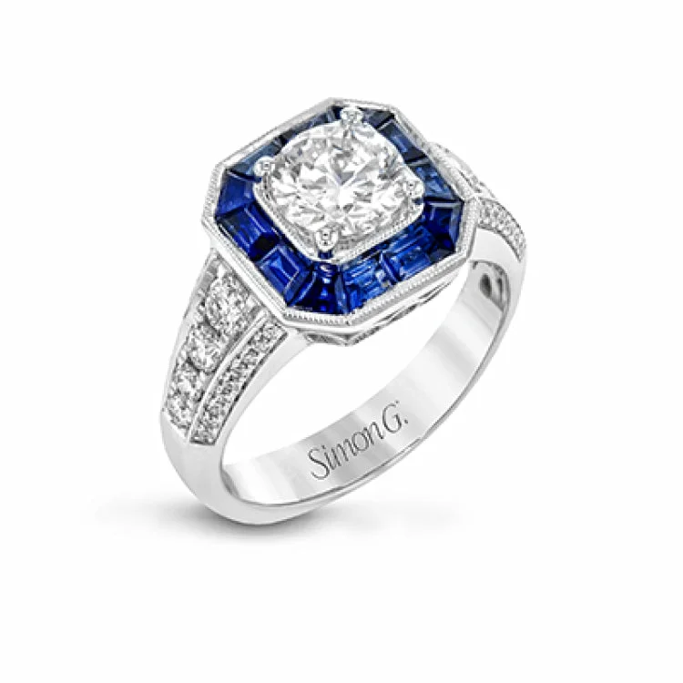 ladies rings with blue topaz -This stunning bridal ring design has a unique geometric halo set with 1.03 ctw of beautiful blue sapphires. The rest of the ring contains .52 ctw of white diamonds.