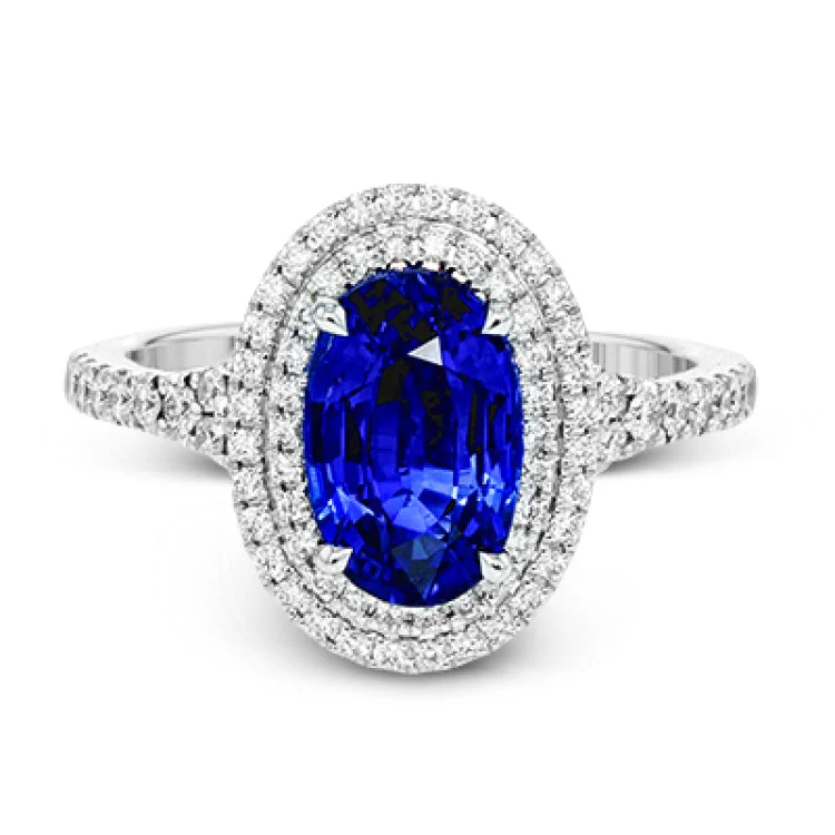 ladies rings platinum sleek shine -This gorgeous, vintage-inspired white gold ring features a 2.98 ctw oval shaped sapphire framed by a double halo and .42 ctw of round white diamond accents.