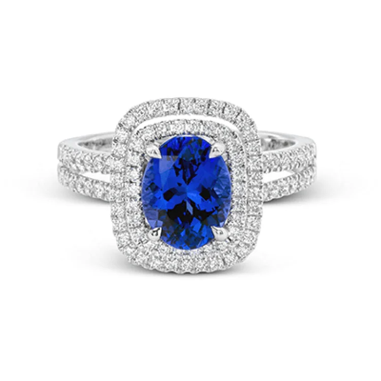 ladies rings elegant gold tone -This arresting white gold ring features a classic design set with a 1.90 ctw natural sapphire silhouetted by twin silhouettes accented by .51 ctw of round white diamonds.