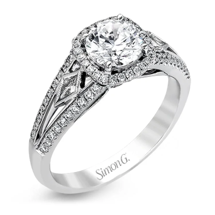 ladies rings romantic delicate style -This elegant white gold ring features a lovely vintage style accentuated by .27 ctw of round cut white diamonds and .11 ctw of kite shaped diamonds.