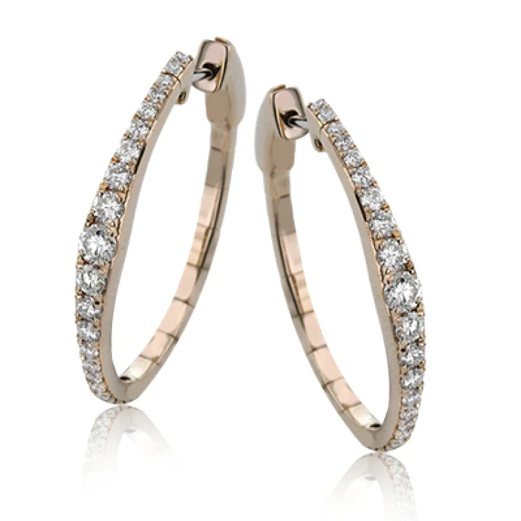 ladies rings geometric unique shape -Dress up your classic button down with these 18K white gold hoops featuring .97cttw diamonds.