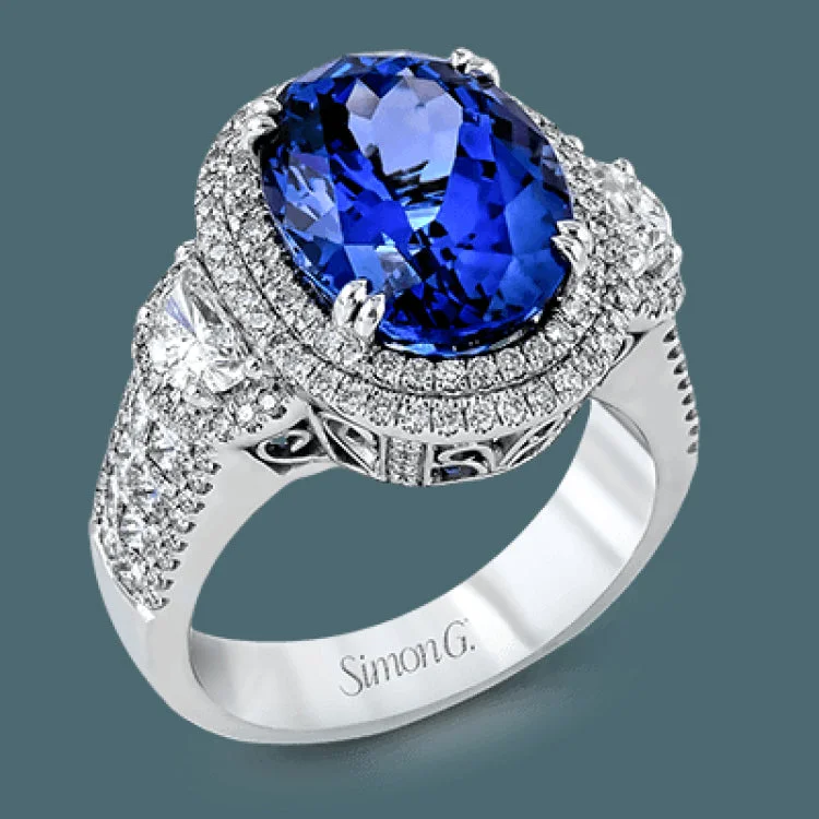 ladies rings infinity symbol charm -This substantial cocktail ring features an impressive 10.59 ct tanzanite center stone, accented by .73 modified half moon shaped diamonds, .62 ctw princess cut diamonds, and .65 ctw round diamonds.