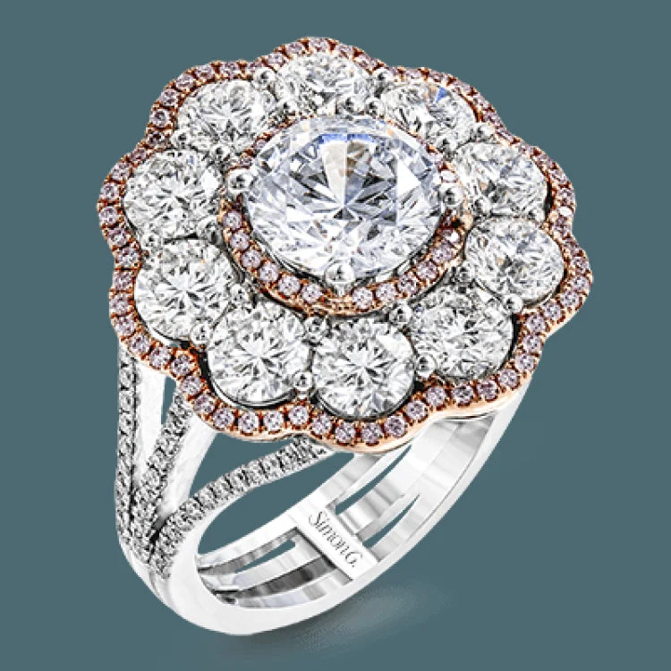 ladies rings dramatic bold style -The dramatic floral cluster design of this white and rose gold vintage-inspired ring is set with 2.45 ctw round cut white diamonds and .21 ctw pink diamonds.